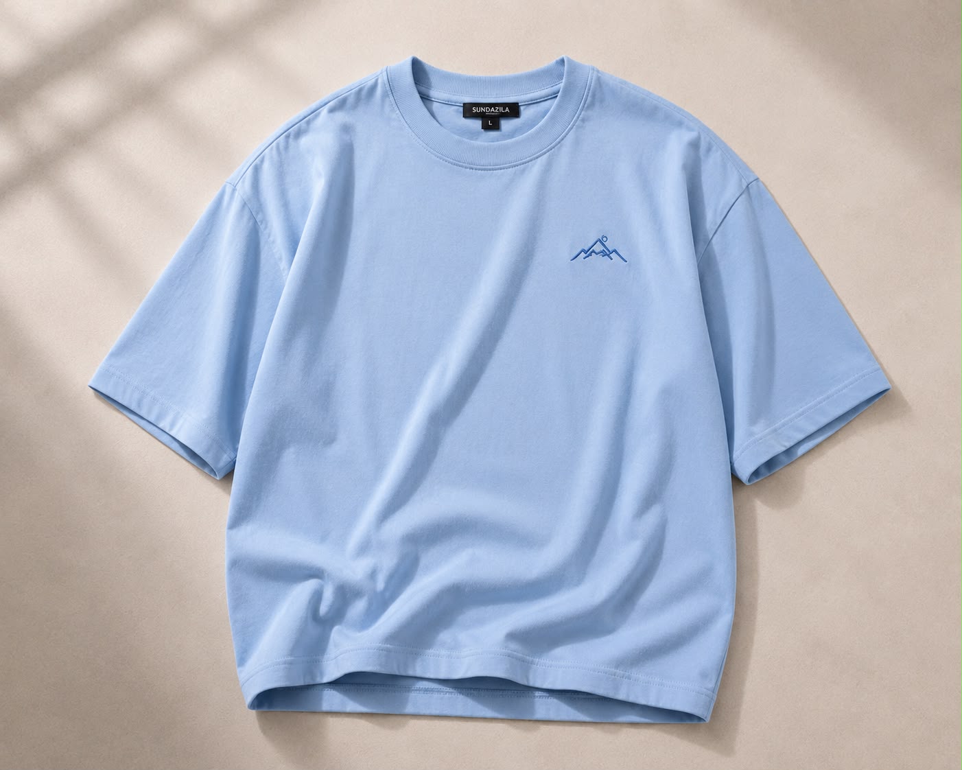 Sky blue oversized t-shirt with mountain embroidery